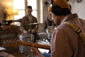 man-working-music-studio-with-instruments